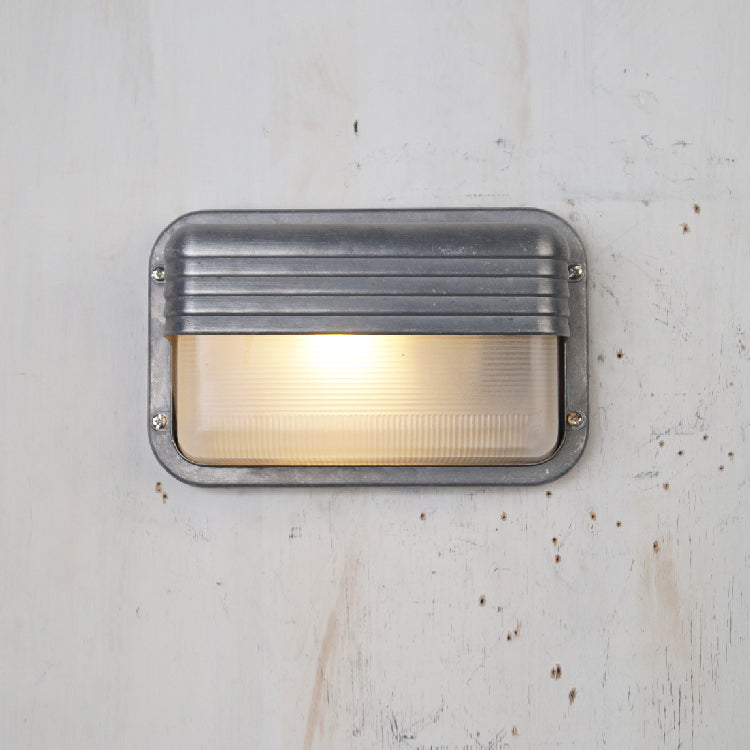 Aluminum Outdoor Bulkhead Wall Sconce with Sealed Glass | Weather-Resistant Light