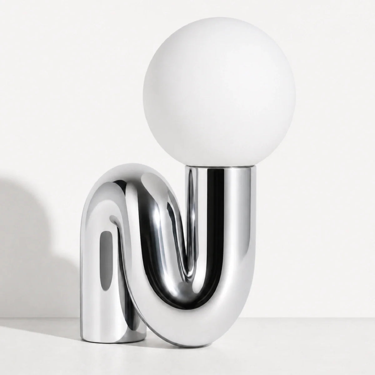 Sculptural S-Curve Table Lamp with Chrome Base | Frosted Glass Globe for Ambient Glow
