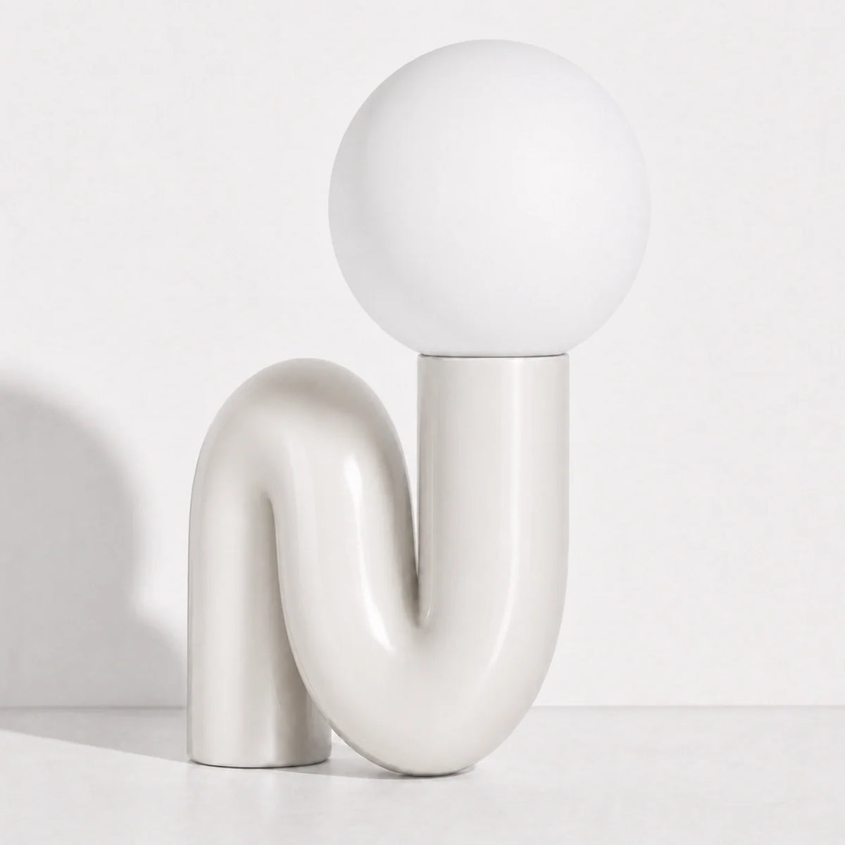 Sculptural S-Curve Table Lamp with Chrome Base | Frosted Glass Globe for Ambient Glow